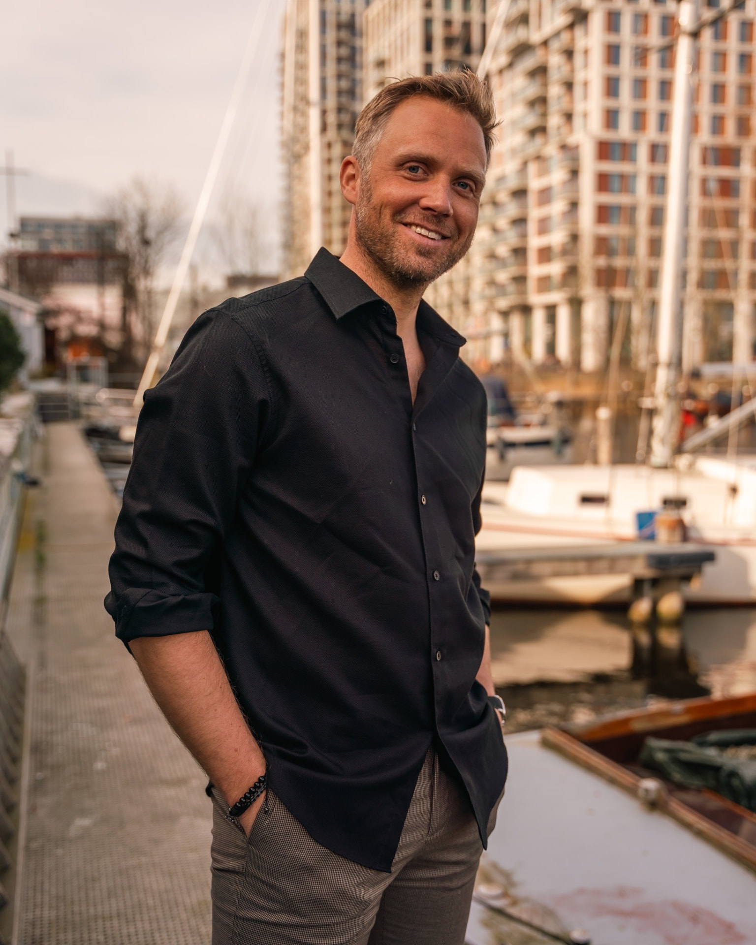 Daniël Veen, co-founder of Windward Rev, on a harbour jetty
